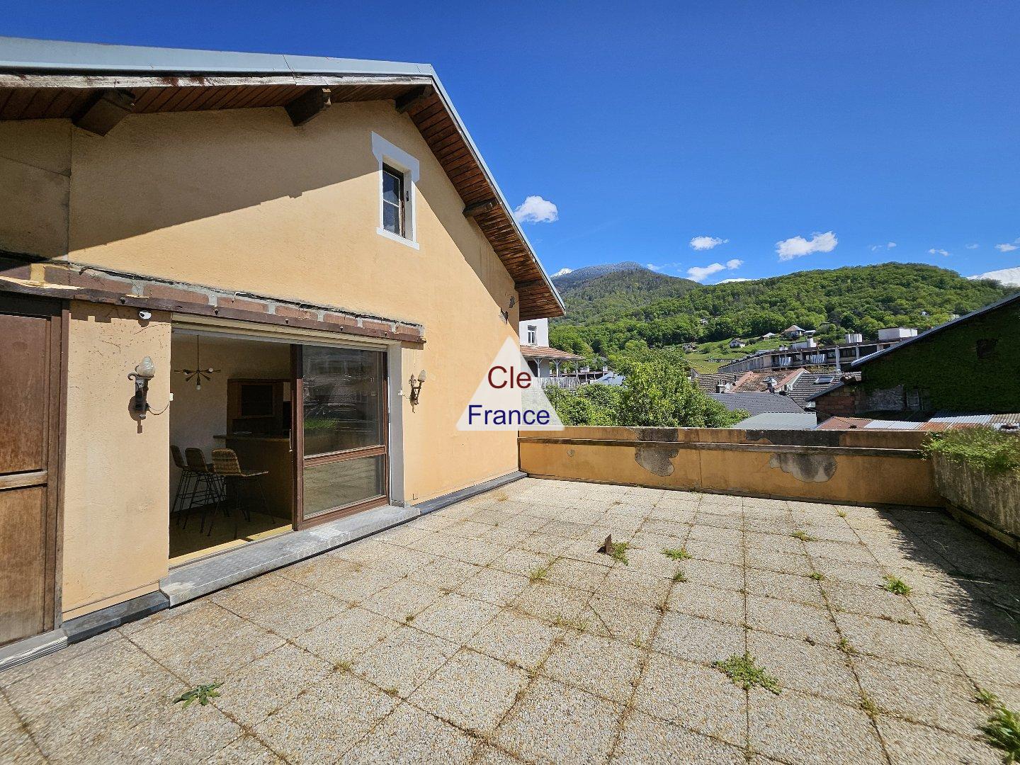 House with Terrace Overlooking the Mountains