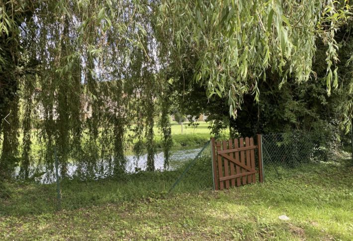 Detached House with Landscaped Garden by a River