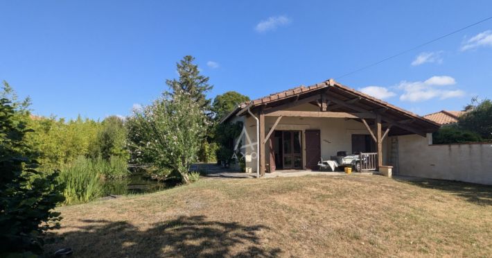 Charming and Cosy House with Bridge over Pond in Garden