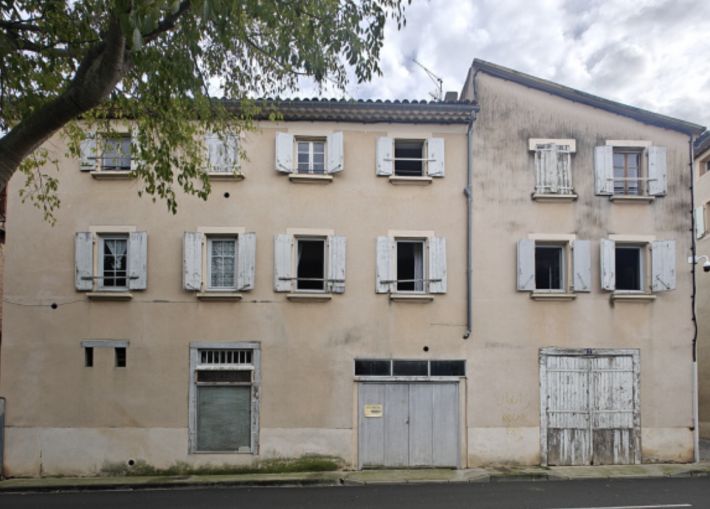 House To Renovate Overlooking a Square